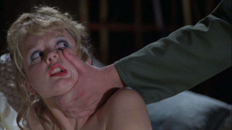 A man holds down a young woman he is about to murder